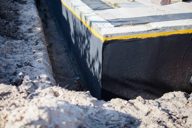 Professional Waterproofing technician working in Holton, IN